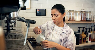 Buy stock photo Barista, machine and woman with milk in coffee for latte order, espresso preparation and premium caffeine. Hospitality industry, girl server and mug for hot beverage, mocha blend and customer service