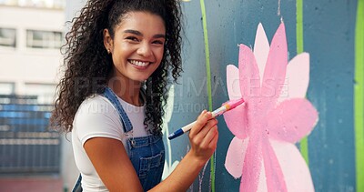 Buy stock photo Painting, mural and portrait of woman with wall for art design, creative project and community service. Artist, volunteer and person with paintbrush for flower decor, inspiration or DIY hobby in city