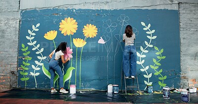 Buy stock photo Women, creative or friends painting on wall for mural, drawing flowers or community service at building. Artist, outdoor or girls with teamwork for floral decoration, renovation or project for design