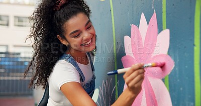 Buy stock photo Painting, mural and woman with wall in city for art design, creative project and community service. Artist, volunteer and person with paintbrush outdoor for flower decor, inspiration and DIY hobby