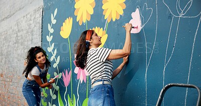 Buy stock photo Women, teamwork or friends painting on wall for mural, drawing flowers or community service at building. Artist, creative or girls with brush for floral decoration, renovation or project for design 