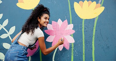 Buy stock photo Woman, excited or artist painting on wall for mural, drawing flowers or community service at building. Smile, outdoor or happy girl with color for floral decoration, renovation or project for design