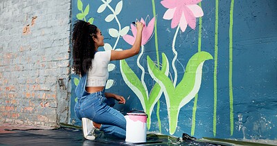 Buy stock photo Woman, back or artist painting on wall for mural, drawing flowers or community service at building. Creative person, outdoor or girl with color for floral decoration, renovation or project for design