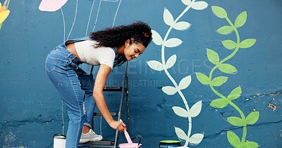 Buy stock photo Woman, creative or painting on wall for mural, drawing flowers or community service at building. Artist, outdoor or girl with color for floral decoration, renovation or project for aesthetic design