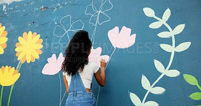 Buy stock photo Woman, back or painter with wall for mural, drawing flowers or community service at building. Creative person, painting and girl with color for floral decoration, renovation or project for design