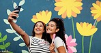 Selfie, painting and wall with friends in city for flower mural, earth day promotion or eco artist. Sustainability awareness, environment activist and photography with women and biodegradable painter