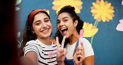 Buy stock photo Selfie, painting and wall with friends and peace sign for flower mural, earth day promotion or smile. Urban project, environment activist and photography POV with portrait of women and eco painter