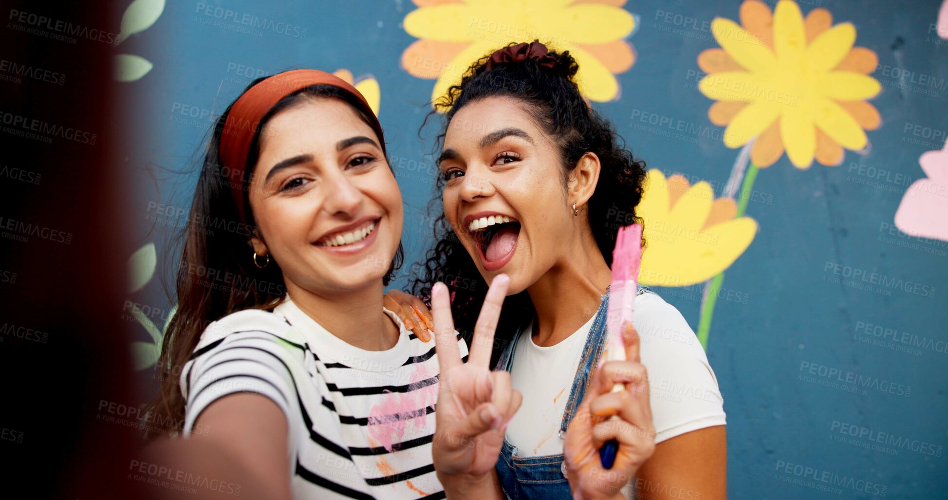 Buy stock photo Selfie, painting and wall with friends and peace sign for flower mural, earth day promotion or smile. Urban project, environment activist and photography POV with portrait of women and eco painter