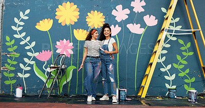 Buy stock photo Outdoor, friends and women with wall art, smile and help for community service, confident and creative. Mural, happy and people with paintbrush for decoration, flowers and volunteers in Canada