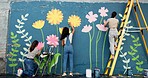 Wall art, women and painting mural outdoor for sustainable awareness, community project or creative teamwork. Flower decoration, people and floral inspiration for diy public design, earth day or back