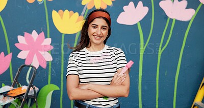 Buy stock photo Mural, smile and woman with arms crossed, painting and proud of decoration for wall art and outdoor. Creative, painter and confidence for design in neighbourhood, happy or community project in Canada
