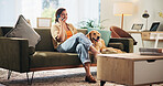 Home, phone call and woman with dog on sofa for bonding, animal care and relax in living room. Talking, pet and person with Golden Retriever on smartphone for online chat, social media and contact