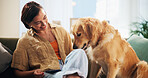 Dog, woman and phone with play on sofa in home, relax and care with bonding, happy and trust in lounge. Person, pet and golden retriever with smartphone, training and loyalty with love at apartment