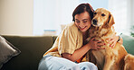 Woman, golden retriever and hug in home on sofa, smile and bonding in morning for love in living room. Excited girl, dog mom and pet animal with embrace, touch and loyalty for care at apartment