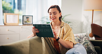 Buy stock photo Woman, smile and tablet on sofa, relax and streaming with funny video in living room at apartment. Girl, person and digital touchscreen with app, movie subscription and happy for social media in home