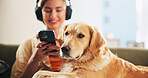 Dog, woman and phone on sofa in home, relax and listen to music with mobile app, bonding and trust. Animal, pet and golden retriever with girl, smartphone and audio subscription with care in lounge