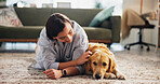 Petting, relax and dog with woman on floor of living room for love, bonding and loyalty. Trust, animal adoption and care with person and golden retriever at home for support, domestic and happiness
