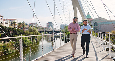 Buy stock photo Tablet, walk and business men in city with company planning, collaboration and budget discussion. Teamwork, digital technology and financial managers with conversation, partnership and research