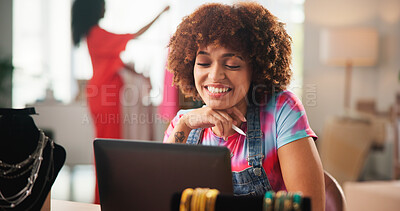Buy stock photo Woman, fashion designer and happy by laptop for search for material, deal and discount on web at workshop. Person, pc and excited for lead with online shopping for fabric, sale and email at studio