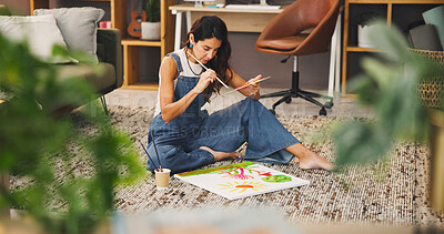 Buy stock photo Home, painting and woman on floor, creative development and inspiration with artistic expression. Mature person, relax and painter on ground, brushes and canvas with freelance designer and project