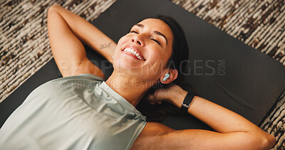 Buy stock photo Happy, woman or earphones with fitness break in home, music or podcast for exercise motivation or rest. Wellness, workout recovery or above of person with wireless audio tech, radio or relax in house