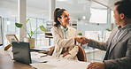 Handshake, meeting and partnership with business people in office for agreement, contract or deal. B2B, collaboration and laptop with employee team shaking hands in corporate workplace for thank you