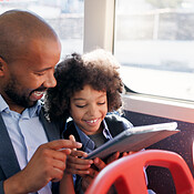 Travel, tablet and kid with father in bus for morning commute, journey ...