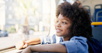 Thinking, bus or travel with kid, smile or boy for commute with urban journey, scholarship and school trip. Academy, passenger or child by window with imagination, public transport or adventure ideas