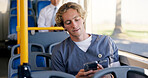 Commute, nurse and phone with man on bus for communication or travel to healthcare job. Public transportation, scrubs and social media with medical professional in vehicle for journey to work