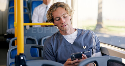 Buy stock photo Commute, nurse and phone with man on bus for communication or travel to healthcare job. Public transportation, scrubs and social media with medical professional in vehicle for journey to work