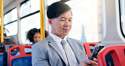 Buy stock photo Business, commute and phone with Asian man on bus for public transportation to work destination. App, social media and travel with corporate employee on coach or shuttle for morning journey to job