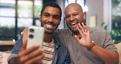 Buy stock photo Gay, love and happy couple on video call in home together for bonding, relationship or communication. Virtual chat, lgbtq or men with smile or greeting on mobile app for social media, wave or selfie