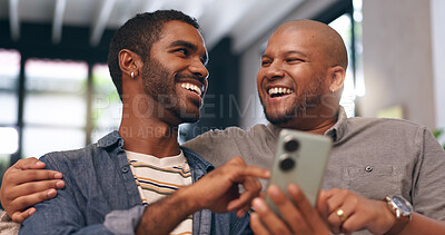 Buy stock photo Gay couple, men and laugh on sofa with phone for social media, internet streaming or bonding with smile. Lgbtq, home and smartphone for online joke, meme or website conversation with funny app