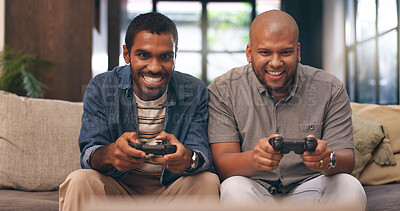 Buy stock photo Home, friends and gaming with controller on sofa for multiplayer, competition and entertainment. Happy, people and men with smile in living room for esports challenge, streaming and playful contest