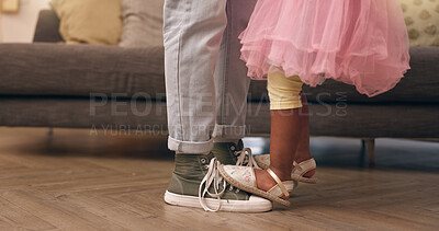 Buy stock photo Dance, feet and parent with child in living room of home for bonding, development or learning. Balance, legs and music with father and daughter closeup in apartment for love, teaching or trust