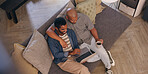Coffee, hug and laptop with gay couple on sofa in living room of home together from above. Break, happy and smile with lgbt men embracing in apartment for browsing, love or romance on weekend