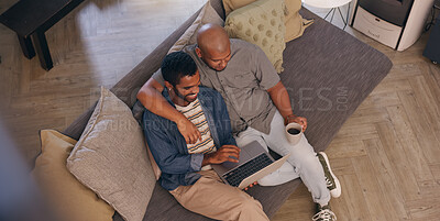 Buy stock photo Coffee, hug and laptop with gay couple on sofa in living room of home together from above. Break, happy and smile with lgbt men embracing in apartment for browsing, love or romance on weekend