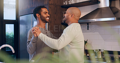 Buy stock photo Gay couple, smile and dancing in home for bonding, entertainment and romance in kitchen of house. Lgbtq, confidence and men with music, together and weekend for celebration, happiness and love