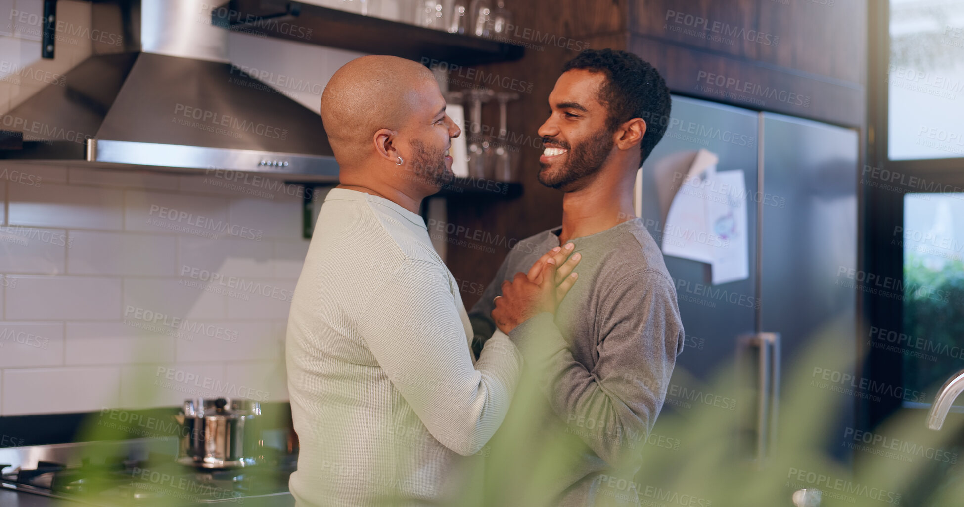 Buy stock photo Gay couple, smile and dancing in house for bonding, entertainment and romance in kitchen of home. Lgbtq, confidence and men with music, together and weekend for celebration, happiness and love