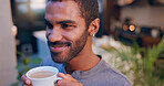 Man, thinking and coffee in home with relax, morning routine and favorite beverage. Male person, drinking caffeine and smile in living room with reflection, wellness and break on weekend in apartment