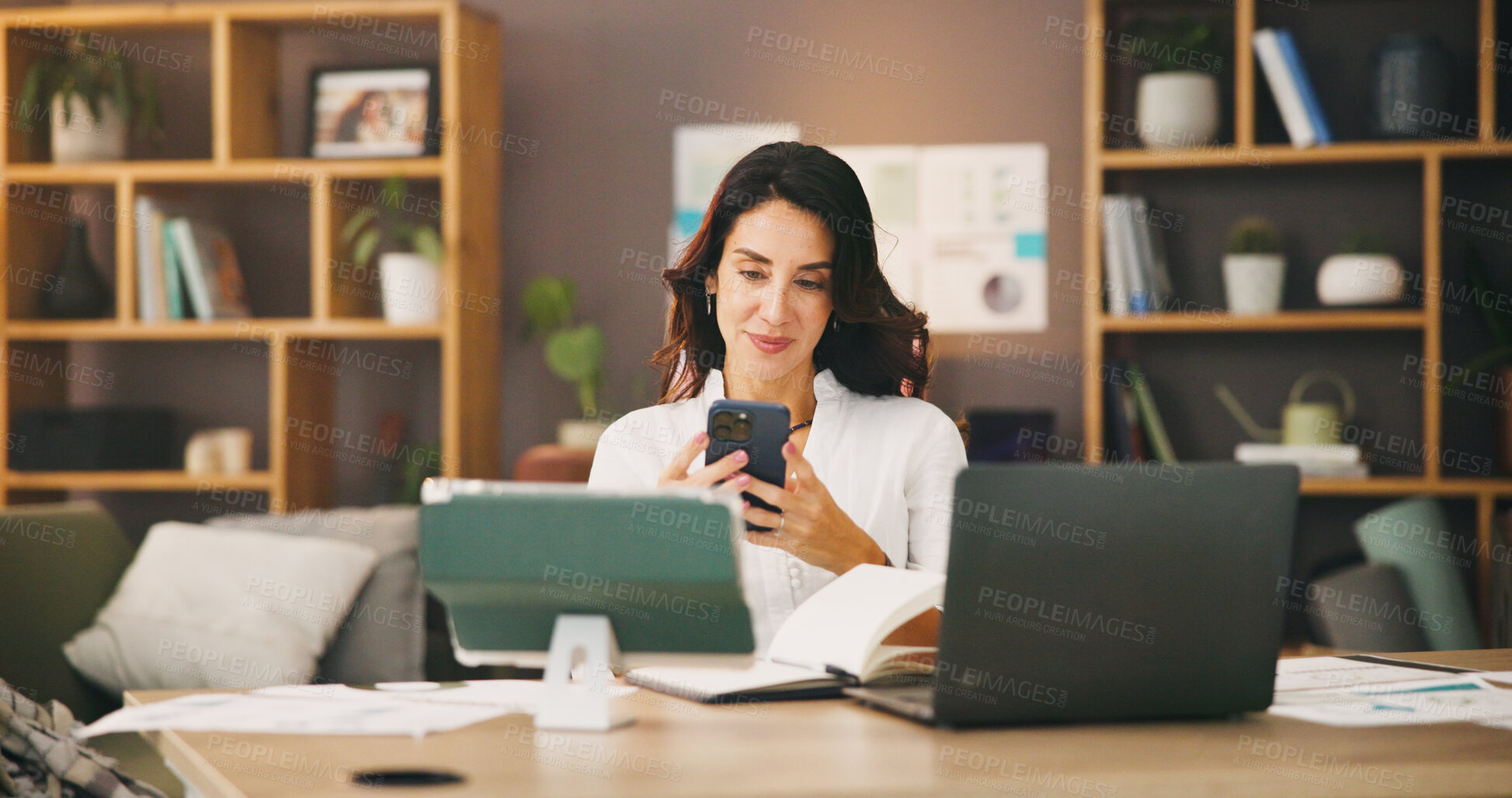 Buy stock photo Typing, phone and remote worker with woman in home office for research, communication and reading. Freelancer, online review and networking with person in living room for entrepreneur feedback