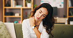 Stress, sofa and woman in house with neck pain, injury or muscle tension in living room. Hurt, cramp and female person relaxing in lounge with inflammation, sprain or discomfort with ache in home
