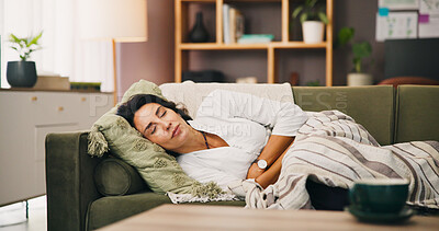 Buy stock photo Sick, cramps or woman with stomach ache on sofa for illness, tummy pain or menstruation problem. Period, endometriosis or person with sore abdomen for PMS, menstrual discomfort or indigestion in home