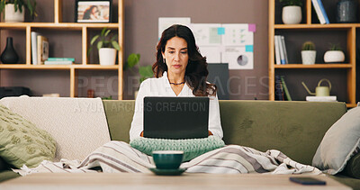Buy stock photo Laptop, remote work and woman on sofa for typing email, reading or serious financial analyst with project. Computer, living room and freelancer writing report for investment data or metrics in home