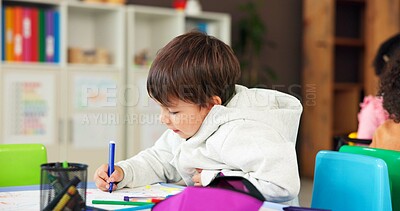 Buy stock photo Color, education and drawing with boy in classroom for child development, artwork and creative project. Youth, academy and growth with students at school for knowledge, learning and kindergarten