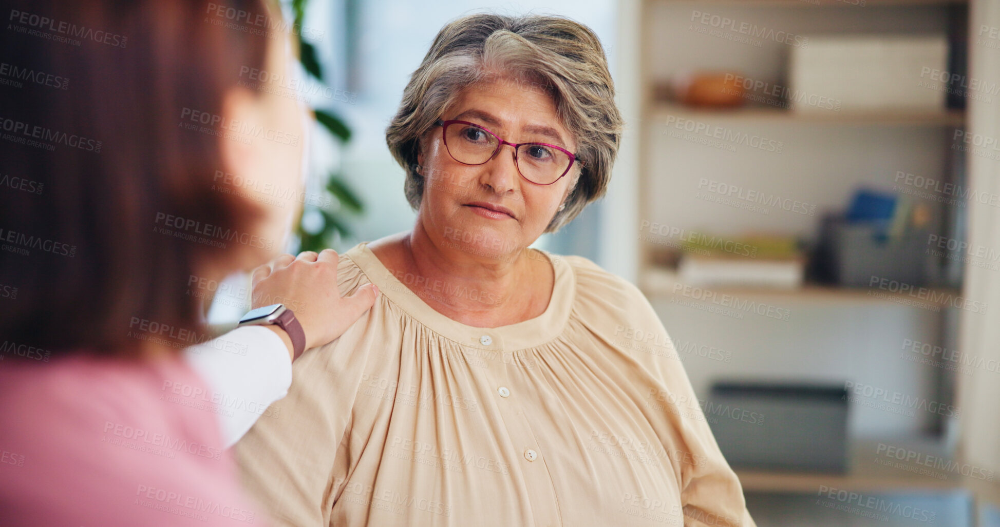 Buy stock photo Nurse, patient and helping hand with support for homecare, empathy for news in consultation. Advice, counseling and compassion for kindness with female caregiver for senior care in retirement