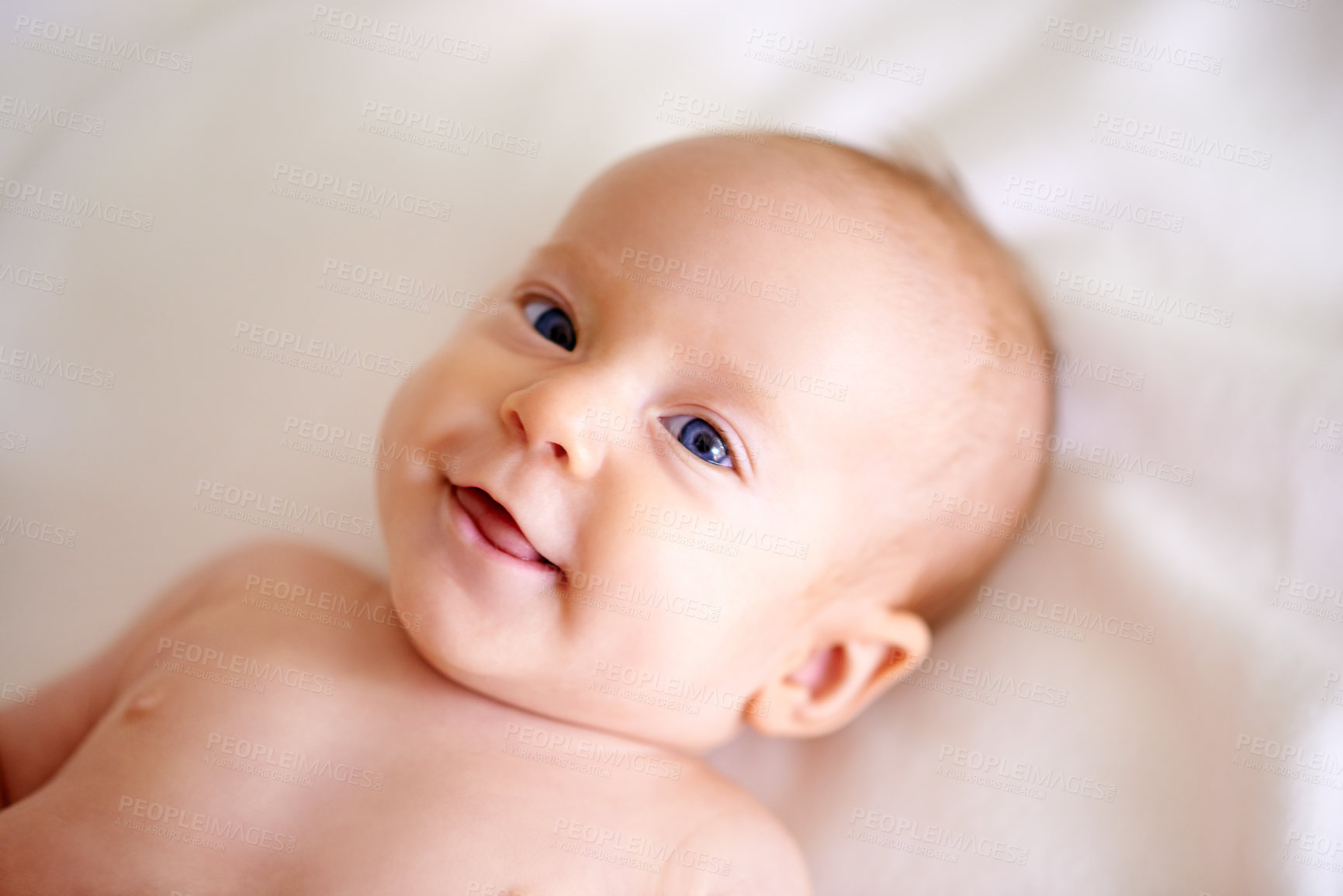 Buy stock photo Baby, newborn and happy on bed with excited face for listening, hearing and audio at home. infant or little girl waking up with smile and curious expression for vision, discovery and wonderment 