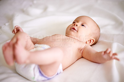 Buy stock photo Calm, baby and relax on sheet of bed with diaper for comfortable, delicate and growth in nursery. Body, peace and infant with curiosity on linen for future development, childhood and rest at home