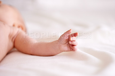 Buy stock photo Baby, arm and hand on sheet of bed with rest for comfortable, growth and sleeping in nursery. Peace, relax and newborn with tiny fingers on linen for future development, childhood and calm at home