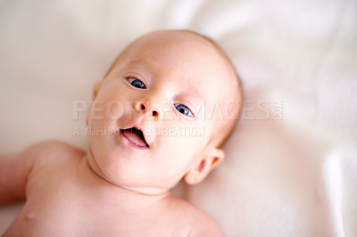 Buy stock photo Infant, relax and portrait on sheet of bed with smile for comfortable, growth and rest in nursery. Cute, blue eyes and face of baby on linen for future development, childhood and resting at home